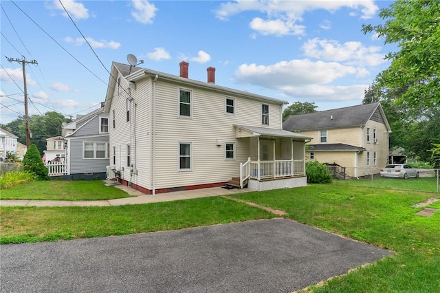 10 Foundry St, Central Falls, RI 02863 - back of house featuring a chimney
