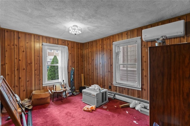 10 Foundry St, Central Falls, RI 02863 - living area featuring a wall mounted air conditioner, carpet flooring, wooden walls, and a textured ceiling