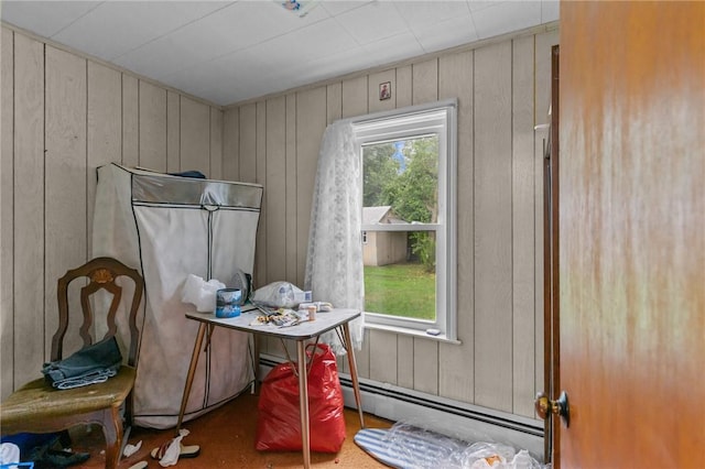 10 Foundry St, Central Falls, RI 02863 - dining space featuring baseboard heating and wood walls