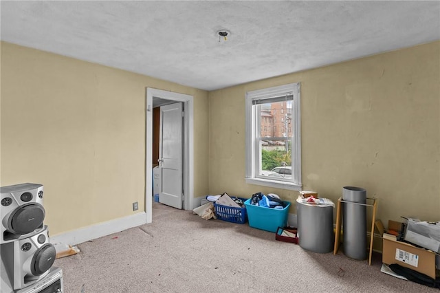 10 Foundry St, Central Falls, RI 02863 - carpeted empty room with baseboards and fire sprinkler in ceiling