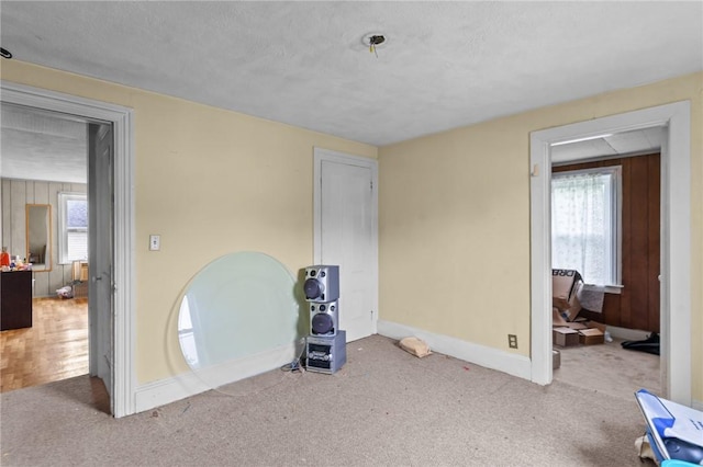 10 Foundry St, Central Falls, RI 02863 - unfurnished bedroom with baseboards and carpet