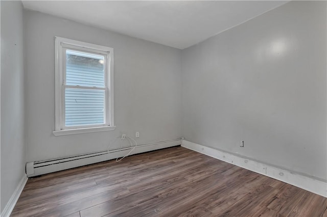 1 Ware St, Providence, RI 02907 - spare room with a baseboard heating unit and wood finished floors