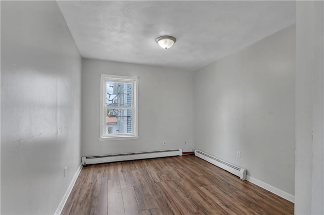 1 Ware St, Providence, RI 02907 - unfurnished room with baseboard heating and wood finished floors