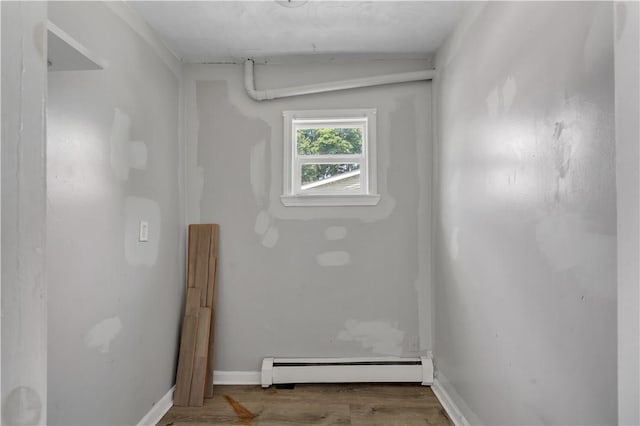 1 Ware St, Providence, RI 02907 - bathroom with a baseboard heating unit and wood finished floors