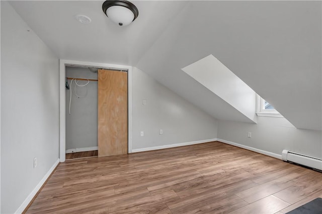1 Ware St, Providence, RI 02907 - bonus room featuring a skylight, vaulted ceiling, baseboard heating, and wood finished floors