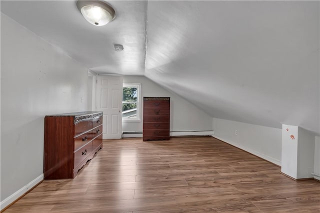 1 Ware St, Providence, RI 02907 - additional living space featuring a baseboard radiator, lofted ceiling, and wood finished floors