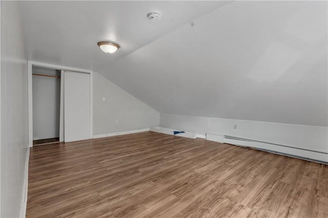 1 Ware St, Providence, RI 02907 - bonus room with wood finished floors, vaulted ceiling, and a baseboard heating unit