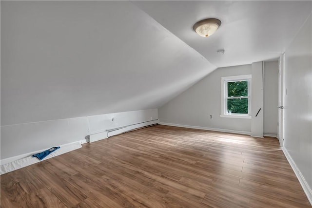1 Ware St, Providence, RI 02907 - additional living space with lofted ceiling, wood finished floors, and baseboard heating