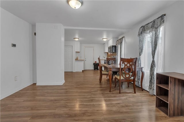1 Ware St, Providence, RI 02907 - dining space featuring wood finished floors and baseboards