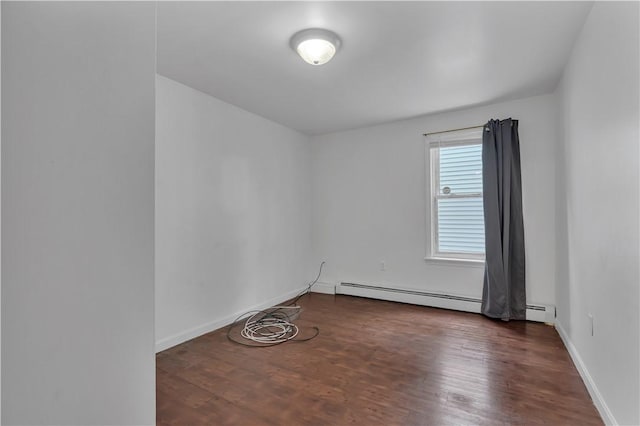 1 Ware St, Providence, RI 02907 - empty room featuring wood finished floors and a baseboard heating unit