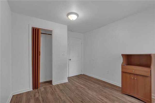 1 Ware St, Providence, RI 02907 - unfurnished bedroom featuring light wood-style flooring and a closet