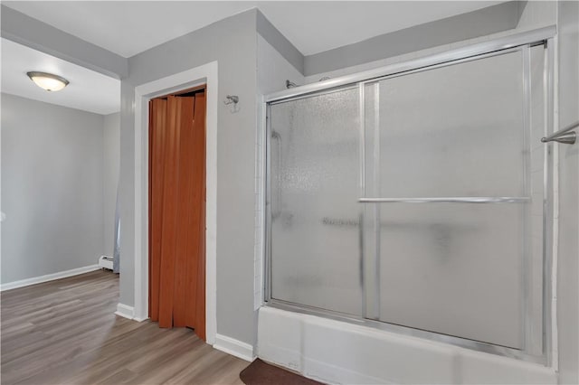 1 Ware St, Providence, RI 02907 - bathroom featuring wood finished floors and combined bath / shower with glass door