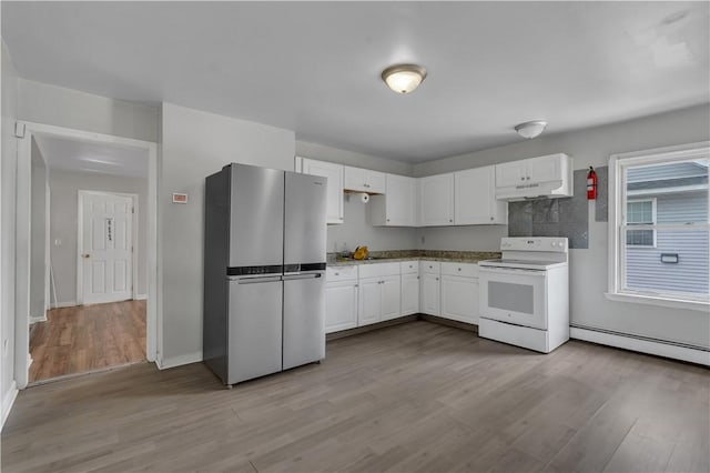 1 Ware St, Providence, RI 02907 - kitchen with freestanding refrigerator, white electric range, under cabinet range hood, white cabinets, and light wood-style flooring