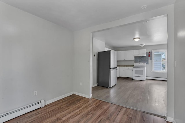 1 Ware St, Providence, RI 02907 - unfurnished living room with baseboard heating and dark wood-style floors