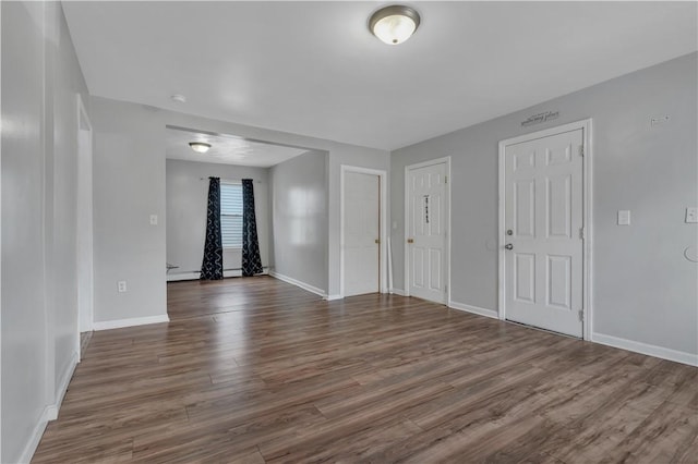 1 Ware St, Providence, RI 02907 - empty room featuring dark wood-style flooring and baseboards