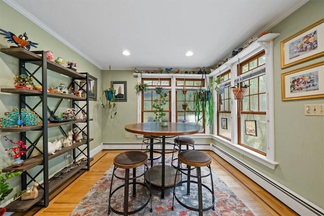 825 Matteson Rd, Coventry, RI 02816 - dining space with baseboard heating, wood finished floors, crown molding, and recessed lighting