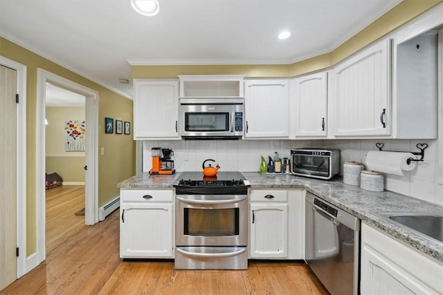 825 Matteson Rd, Coventry, RI 02816 - kitchen with appliances with stainless steel finishes, a baseboard heating unit, white cabinetry, tasteful backsplash, and crown molding