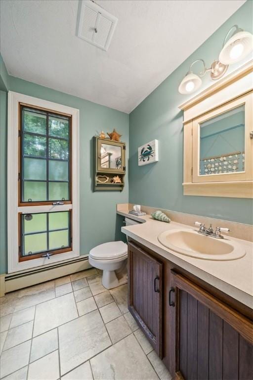 825 Matteson Rd, Coventry, RI 02816 - full bath featuring a baseboard radiator, vanity, and tile patterned flooring