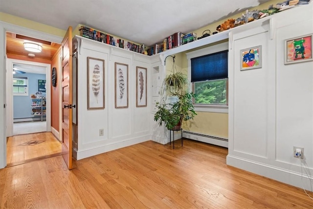 825 Matteson Rd, Coventry, RI 02816 - foyer with a baseboard radiator, baseboard heating, and light wood-style flooring