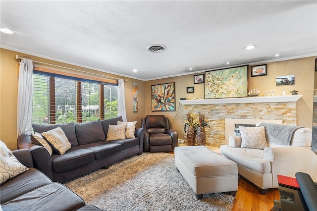 18 Magnolia Ln, Coventry, RI 02816 - living area with ornamental molding, wood finished floors, recessed lighting, and a fireplace