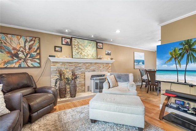 18 Magnolia Ln, Coventry, RI 02816 - living area with ornamental molding, a stone fireplace, recessed lighting, wood finished floors, and a baseboard heating unit