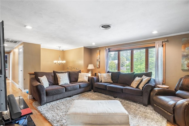 18 Magnolia Ln, Coventry, RI 02816 - living room with crown molding, a chandelier, light wood-type flooring, and recessed lighting