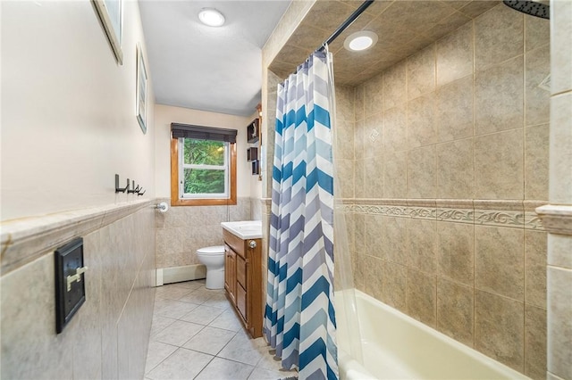 18 Magnolia Ln, Coventry, RI 02816 - bathroom with tile walls, tile patterned floors, vanity, shower / bathtub combination with curtain, and wainscoting