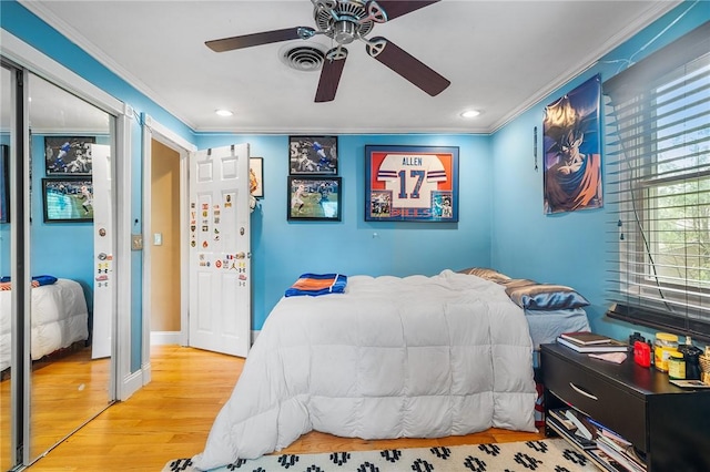 18 Magnolia Ln, Coventry, RI 02816 - bedroom with crown molding, wood finished floors, recessed lighting, ceiling fan, and a closet