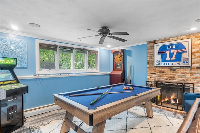 18 Magnolia Ln, Coventry, RI 02816 - game room with wood finished floors, crown molding, a ceiling fan, a fireplace, and billiards table
