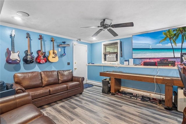 18 Magnolia Ln, Coventry, RI 02816 - playroom with wood finished floors, ceiling fan, ornamental molding, cooling unit, and a baseboard radiator