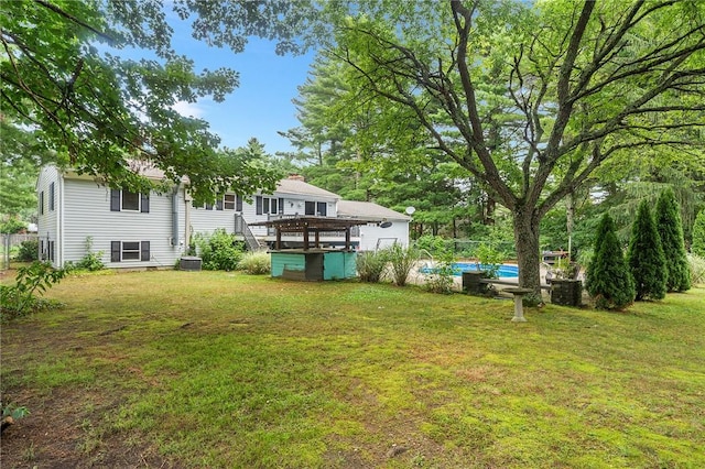 18 Magnolia Ln, Coventry, RI 02816 - view of grassy yard with an outdoor pool