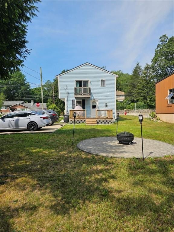 250 Arnold Rd, Coventry, RI 02816 - rear view of property with an outdoor fire pit, a yard, a balcony, a wooden deck, and a patio area
