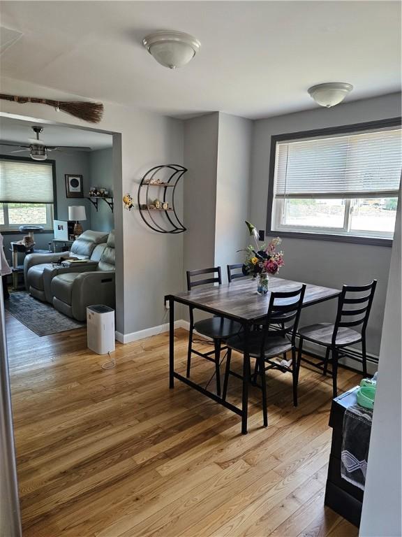 250 Arnold Rd, Coventry, RI 02816 - dining space featuring plenty of natural light and light wood-style flooring