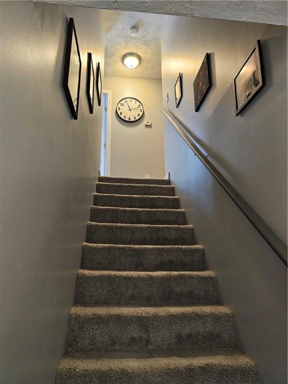 250 Arnold Rd, Coventry, RI 02816 - stairway featuring a textured ceiling