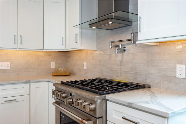 5 Williams St Unit 4, Warwick, RI 02818 - kitchen with stainless steel range, white cabinets, and backsplash