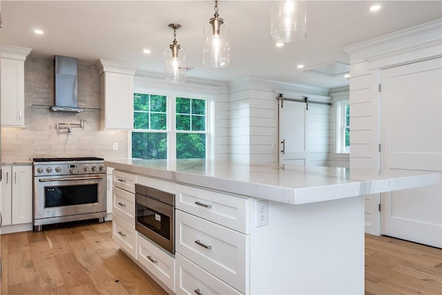 5 Williams St Unit 4, Warwick, RI 02818 - kitchen with appliances with stainless steel finishes, wall chimney exhaust hood, light wood-type flooring, tasteful backsplash, and ornamental molding