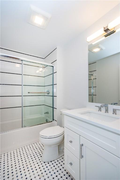 5 Williams St Unit 4, Warwick, RI 02818 - bathroom with vanity, bath / shower combo with glass door, and tile patterned floors
