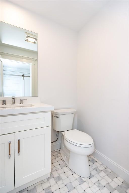 5 Williams St Unit 4, Warwick, RI 02818 - half bathroom with vanity and tile patterned floors