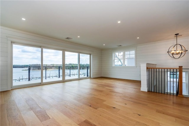 5 Williams St Unit 4, Warwick, RI 02818 - unfurnished living room with ornamental molding, a chandelier, light wood-style flooring, and recessed lighting