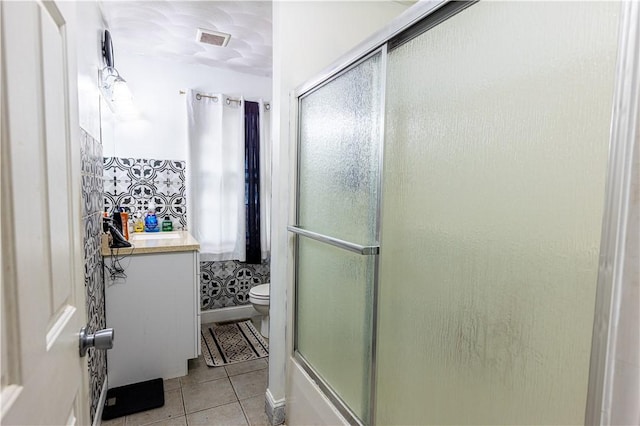 61 Cyr St, Providence, RI 02905 - bathroom with a shower with door, tile patterned flooring, and vanity