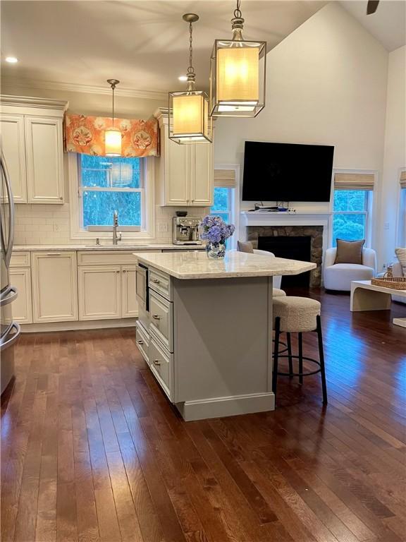 21 Helm St, Jamestown, RI 02835 - kitchen with dark wood-style flooring, open floor plan, a center island, healthy amount of natural light, and vaulted ceiling