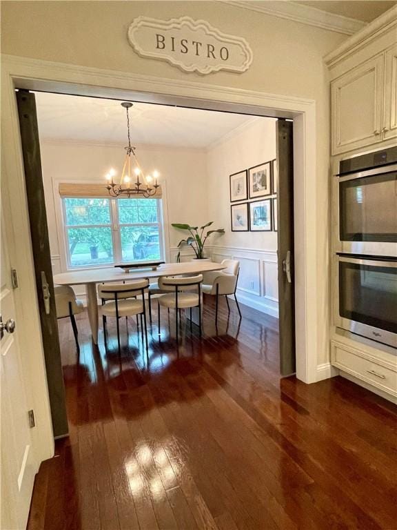 21 Helm St, Jamestown, RI 02835 - dining room with dark wood-style floors, a chandelier, and crown molding