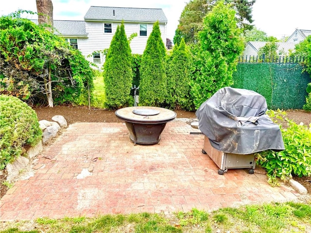 74 Plymouth Rd, East Providence, RI 02914 - view of patio / terrace featuring a fire pit and a grill