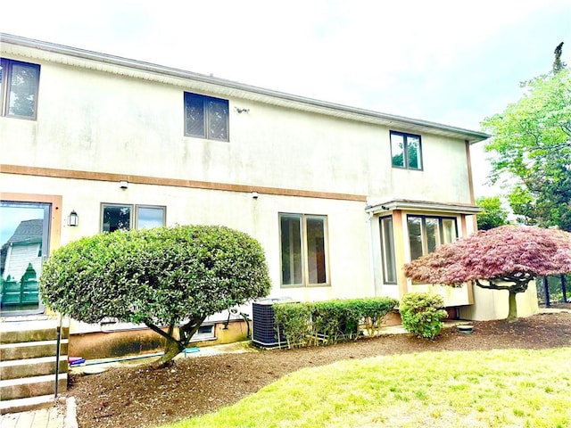 74 Plymouth Rd, East Providence, RI 02914 - rear view of house with stucco siding