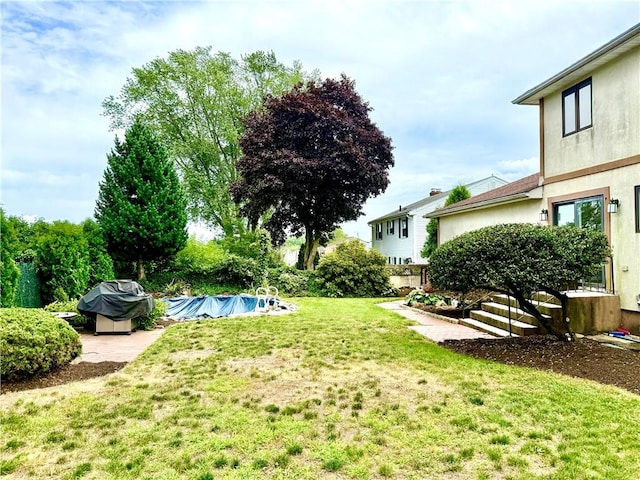 74 Plymouth Rd, East Providence, RI 02914 - view of grassy yard featuring an outdoor pool