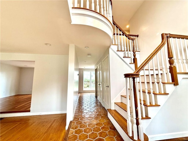 74 Plymouth Rd, East Providence, RI 02914 - stairway with baseboards and recessed lighting