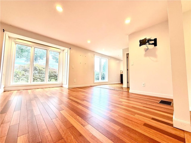 74 Plymouth Rd, East Providence, RI 02914 - unfurnished living room featuring light wood-style floors and recessed lighting