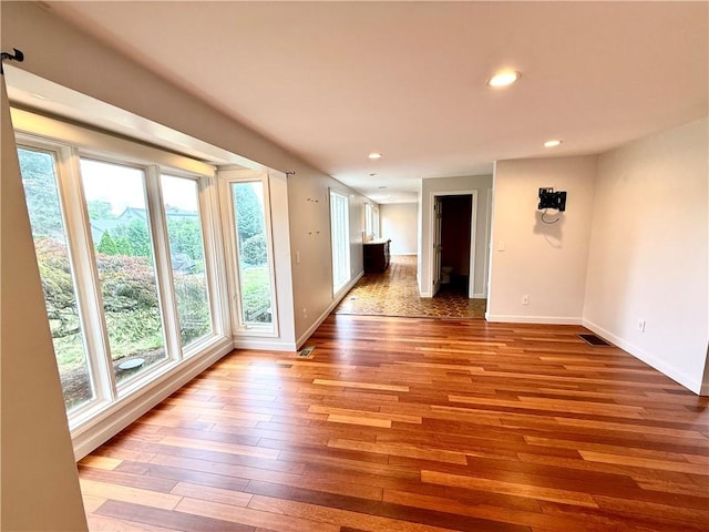 74 Plymouth Rd, East Providence, RI 02914 - unfurnished room featuring plenty of natural light, hardwood / wood-style flooring, and recessed lighting