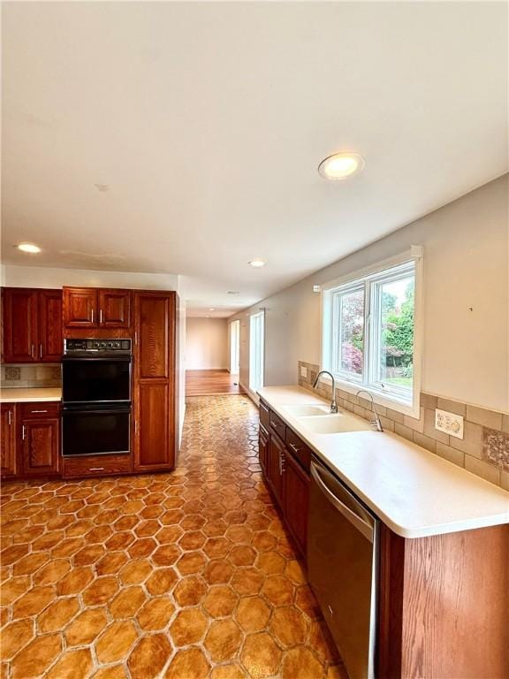 74 Plymouth Rd, East Providence, RI 02914 - kitchen with stainless steel dishwasher, recessed lighting, light countertops, and backsplash