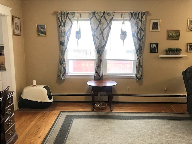 16 Edgemere Rd, Pawtucket, RI 02861 - sitting room with wood finished floors and a baseboard heating unit